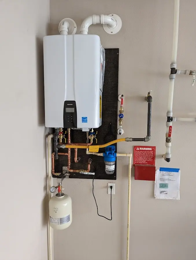 Professional plumber installing copper piping in a Walthourville home